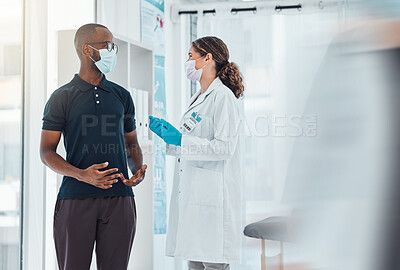 Buy stock photo Covid, mask and doctor, woman consulting patient for corona virus vaccine and treatment. Health check, healthcare and female medical professional helping, talking or conversation in hospital clinic.
