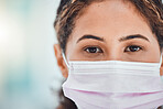 Covid, hospital and portrait of doctor with mask for safety and protection from virus macro. Healthcare woman with anxiety, stress and tired expression in eyes at medical facility mockup.
