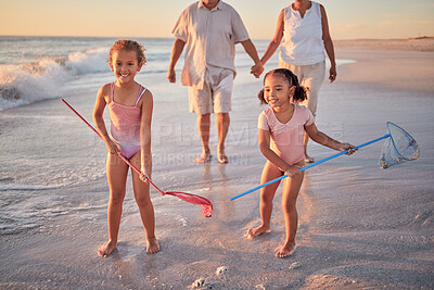 Buy stock photo Children, fishing and beach with a girl, family and sister on the sand by the sea or ocean for fun and playing. Water, nature and kids playing outside during summer vacation, holiday or getaway