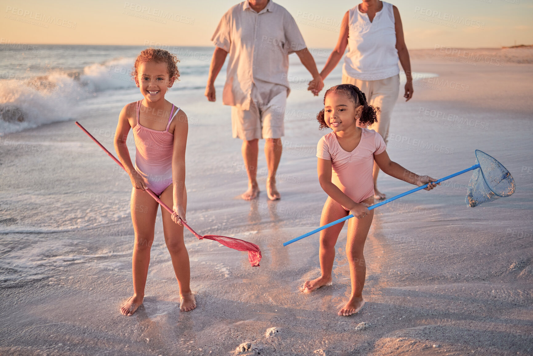 Buy stock photo Children, fishing and beach with a girl, family and sister on the sand by the sea or ocean for fun and playing. Water, nature and kids playing outside during summer vacation, holiday or getaway