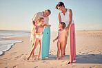 Family, beach and surf with children and parents on the sand by the ocean or sea for surfing, fun and holiday. Water, love and summer with a man, woman and kids on summer vacation at the coast