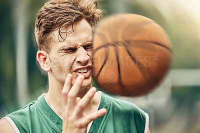 Buy stock photo Sports, basketball and accident with face in game match on athlete court for tournament training. Injured man in professional outdoor fitness centre in pain from impact of ball hit action.