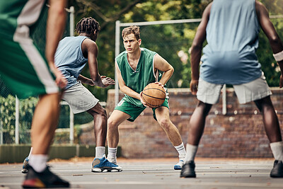 Buy stock photo Basketball, team sport and competition for male athletes and players in training or professional match on an outdoor fitness court. Diversity, competitive and skill of men playing a ball game in USA