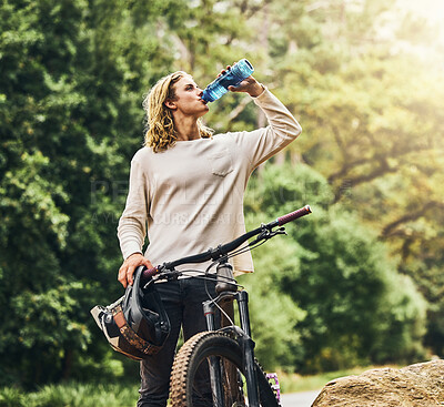 Buy stock photo Mountain bike, drinking water and man from Berlin in nature after a adventure sport workout. Sports, exercise and fitness ride of a healthy person athlete training cardio on a outdoor road by trees