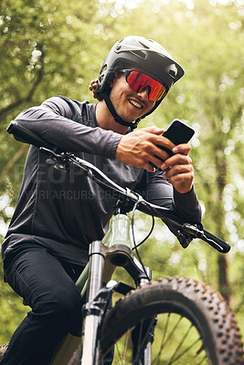 Buy stock photo Mountain bike man in nature, phone gps and map direction for adventure, fitness and bicycle break in woods. Happy cycling sports athlete, smartphone social media typing and location search connection