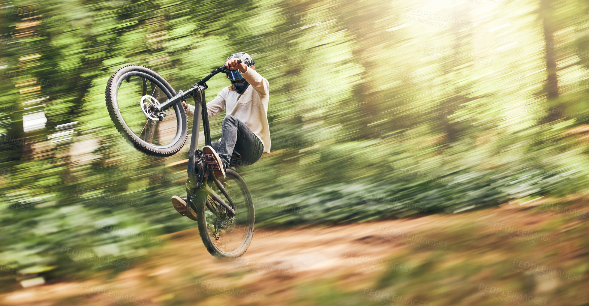 Buy stock photo Motion blur of mountain bike man, action jump and bicycle speed adventure, freedom and fast race in woods. Cycling sports athlete training, moving and energy in forest, nature and outdoor competition