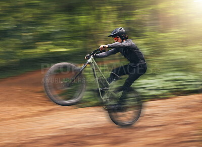 Buy stock photo Freedom, energy and bike with adrenaline cyclist training in nature, practice extreme jumping trick on dirt road. Fitness, bicycle and action by sports man enjoy intense activity, control and speed