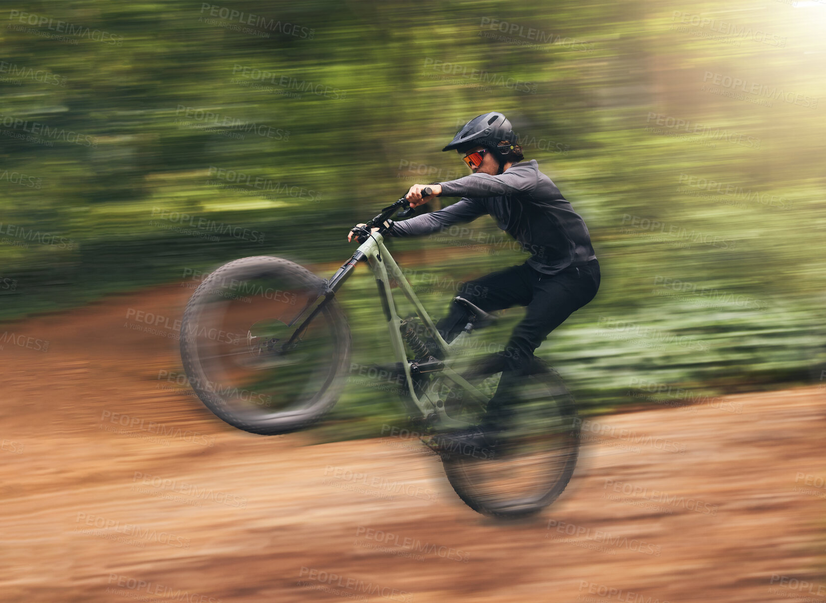 Buy stock photo Freedom, energy and bike with adrenaline cyclist training in nature, practice extreme jumping trick on dirt road. Fitness, bicycle and action by sports man enjoy intense activity, control and speed