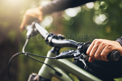 Buy stock photo Forest, mountain biking and trees, hands on handlebar closeup with bokeh. Fitness, health and a man on a bike on outdoor adventure trail. Nature, freedom and exercise, cycling in park on a summer day