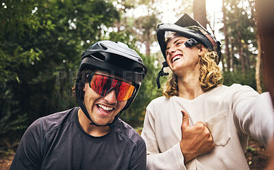 Buy stock photo Friends, cycling men and selfie in forest, park or woods cyclist trail in nature. Thumbs up, fitness and cyclists, bikers or bike rider smile in mountain biking helmets in park outdoor bicycle ride.
