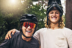 Friends taking a selfie together after cycling through nature trail in the forest. Portrait of cyclist men from Sweden or Norway smiling wearing mountain biking helmets after bicycle ride in a park 