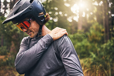 Buy stock photo Bike cyclist, fitness and injury in nature forest, environment or Australian woods after exercise, training and workout. Shoulder pain, medical emergency and healthcare for sports man after accident