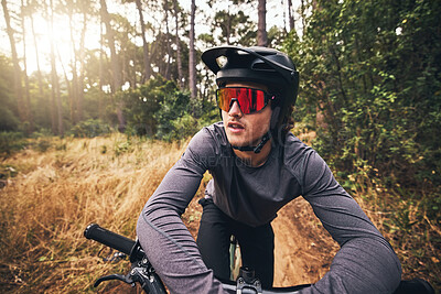 Buy stock photo Cyclist, bike and forest on adventure in nature for health, fitness and wellness. Man, bicycle and sunglasses in woods for travel with helmet on training, exercise or workout on trail by trees