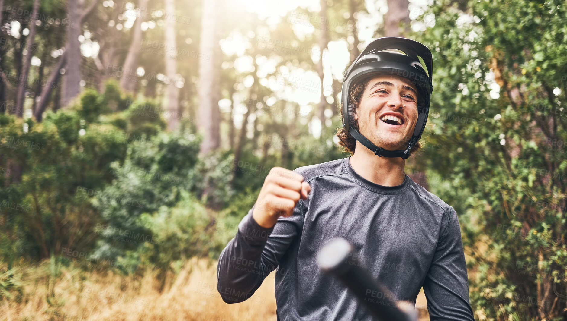 Buy stock photo Mountain biking, achievement and celebrate success, win or freedom on bike in forest woods on a cycling adventure in nature. Fitness man on bicycle looking happy on cycling trip with helmet in Norway