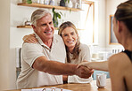 Handshake, thank you and finance with a senior couple planning finance, savings or investment with a broker at home. Banking, portfolio and retirement with an elderly man and woman managing growth