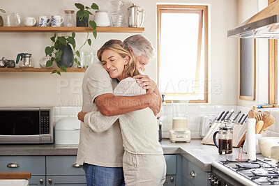 Buy stock photo Hug and support of a retirement couple in a home kitchen  with love, care and mental health. Trust, help and embrace of marriage or pension people, comforting senior partner together in their house