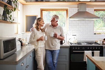 Buy stock photo Senior, couple and drinking coffee with a love, marriage and happiness morning mindset at home. Happy smile and hug of a elderly woman and man with tea in a house kitchen together with quality time