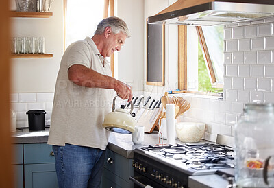 Buy stock photo Retirement man and kettle for tea in kitchen preparation for leisure drink in New Zealand home. Senior, healthy and mature guy enjoying pension lifestyle relaxing in house with a cup of coffee