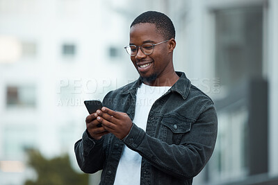 Buy stock photo Black man, phone and smile in city reading email, social media or blog on internet. Man, glasses and smartphone outside in Chicago happy with communication on mobile app via 5G web while outdoors