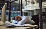 Night business, work sleep and businessman sleeping at desk with computer in dark office at corporate company. Tired African manager or employee taking a nap and resting while working overtime