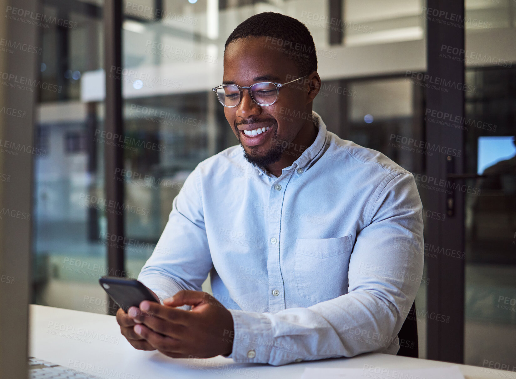 Buy stock photo Black businessman, phone and networking in night office with digital marketing schedule, social media calendar and crm app. Smile, happy or motivation worker with mobile advertising b2b software idea