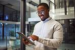 Night business. tablet and black man typing and reading information online doing research and smiling at good results working late. Happy male on internet for marketing strategy in Nigeria office