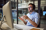 Man, work and call center with glasses in office for telemarketing with pc on desk give support to client. Crm, working and customer service at company, consultant help client on phone call in Sydney