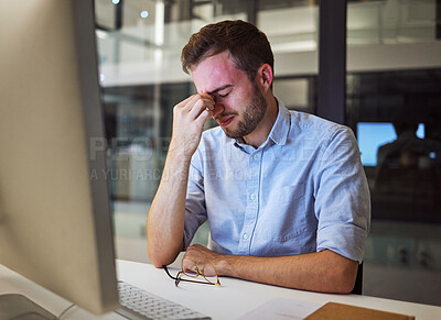 Buy stock photo Burnout, stress and tired businessman with mental health problems struggling while working overtime in an office. Depression, headache and frustrated manager with eye strain, exhausted and overworked