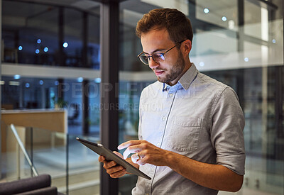 Buy stock photo Man in office, working on tablet at night in the office and testing campaign strategy for marketing company. Dedicated professional employee, working late on project and using technology at business 