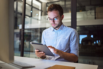 Buy stock photo Tablet planning, night research and businessman working on the internet in a dark office at work. Business employee reading an email on the web with technology during overtime at a corporate company