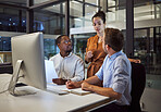 Marketing team in office, working at night on advertising and business strategy. Group meeting by desk, discuss collaboration and teamwork on company report. Teamwork, leadership and career success 
