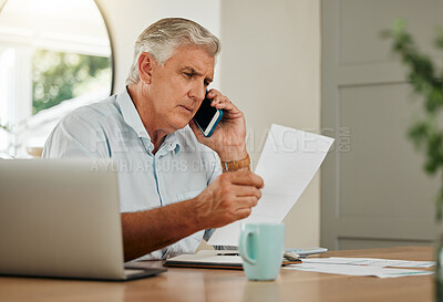 Buy stock photo Senior man on a phone call with finance documents for debt counselling. Old male at home with his laptop and paperwork to check finances, accounting and payments, using his mobile phone for help