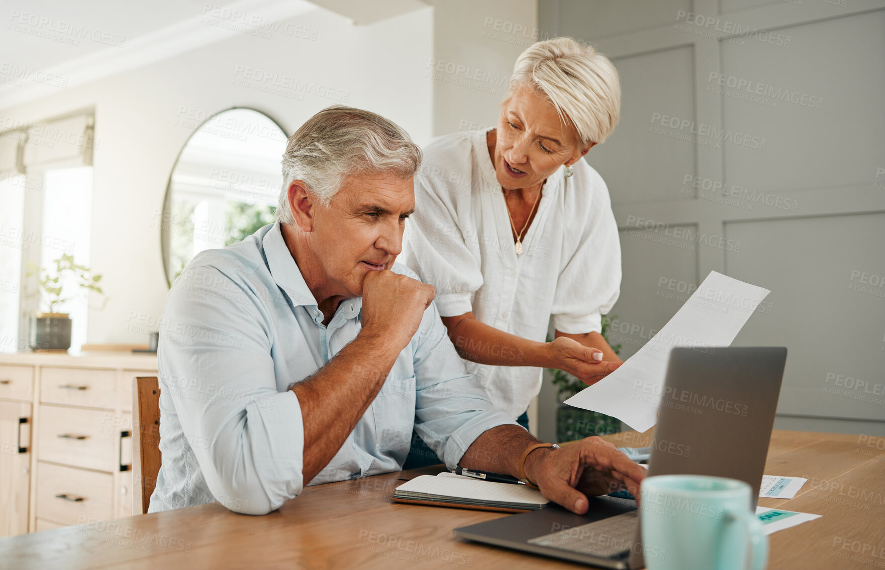 Buy stock photo Retirement planning, finance communication and couple talking about insurance with laptop in living room of home. Senior man and woman speaking about savings with documents and internet banking 