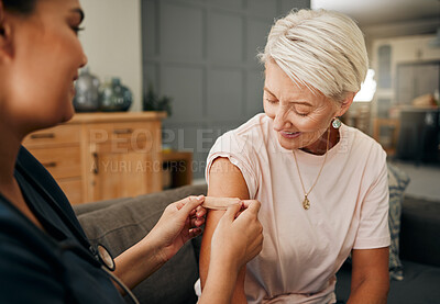 Buy stock photo Covid vaccine, plaster and doctor with patient in a health consultation at a retirement house. Nurse, healthcare worker and elderly woman with a bandaid on her arm after a treatment in a nursing home