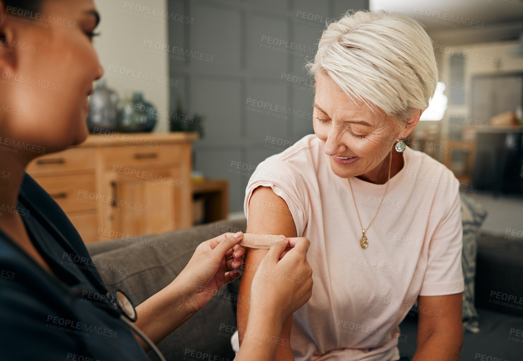 Buy stock photo Covid vaccine, plaster and doctor with patient in a health consultation at a retirement house. Nurse, healthcare worker and elderly woman with a bandaid on her arm after a treatment in a nursing home