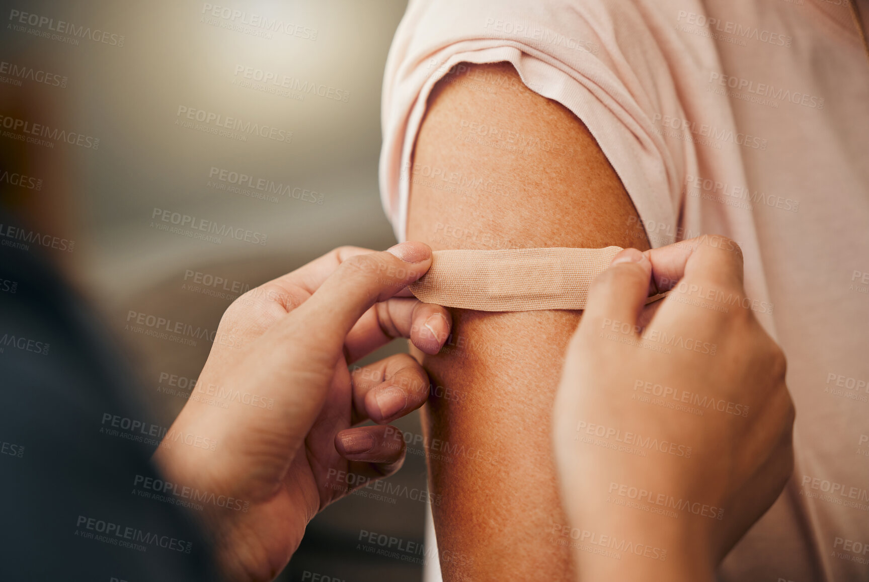 Buy stock photo Covid, vaccine and plaster with a doctor and patient consulting in an appointment or checkup at home. Nurse, healthcare and trust with a health professional using a bandaid on an arm after medication