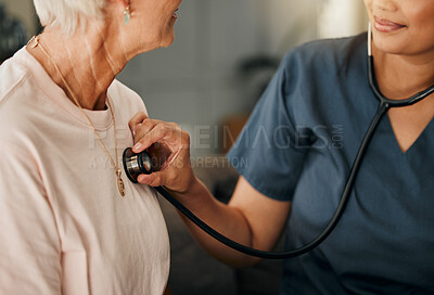 Buy stock photo Cardiology consultation, doctor and senior woman consulting about healthcare on living room sofa in retirement home. Hand of nurse with stethoscope while helping elderly patient with medical service