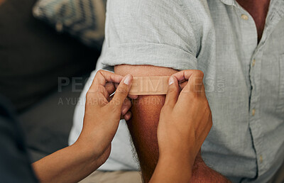 Buy stock photo Covid, vaccine and plaster with hands of a doctor sticking a bandaid on a patient in the hospital or clinic. Healthcare, medicine and trust with a female nurse consulting with a man for health