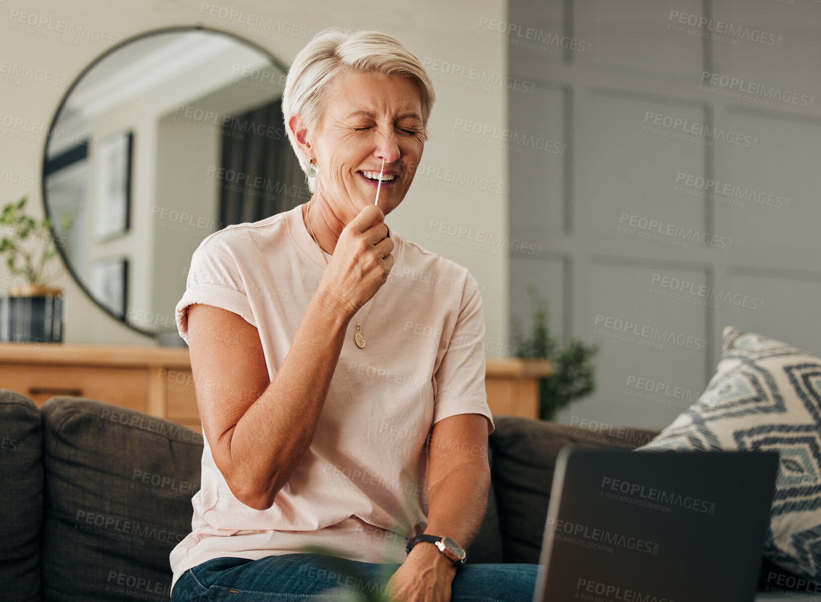 Buy stock photo Covid, laptop and pcr with senior woman laughing during online consultation or tutorial video for self test antigen rapid kit on home sofa. Old lady doing coronavirus nasal swab in Australia house