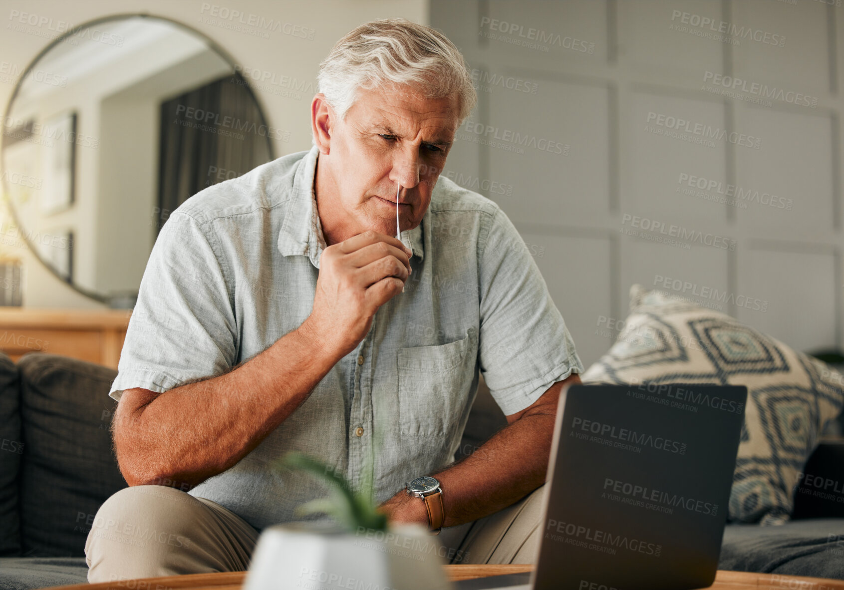 Buy stock photo Covid, pcr and laptop with senior man watching online tutorial or video for medical help for self test antigen rapid kit on home sofa. Old male doing nasal swab for coranavuris in Australia house