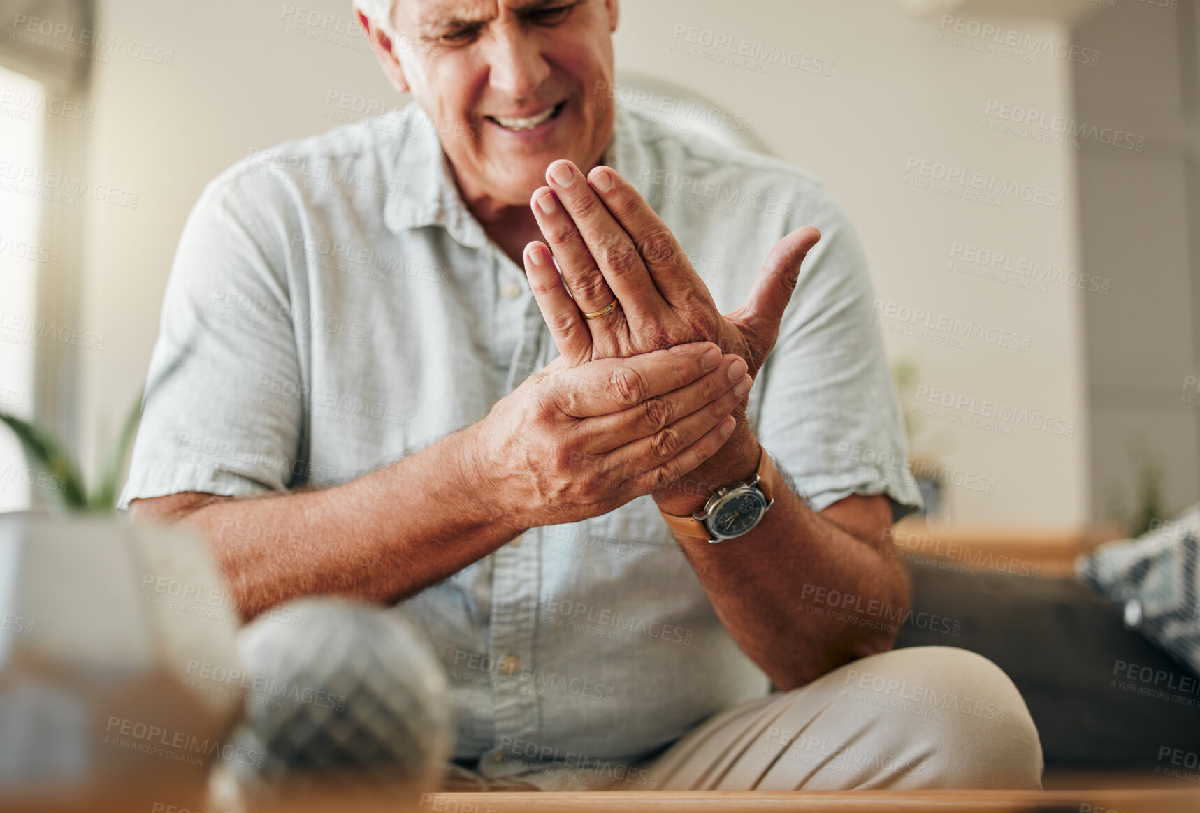 Buy stock photo Senior man, hands and wrist joint pain in living room home from carpal tunnel, osteoporosis and arthritis. Elderly, sick and stress male, orthopedic muscle injury and fibromyalgia health risk problem