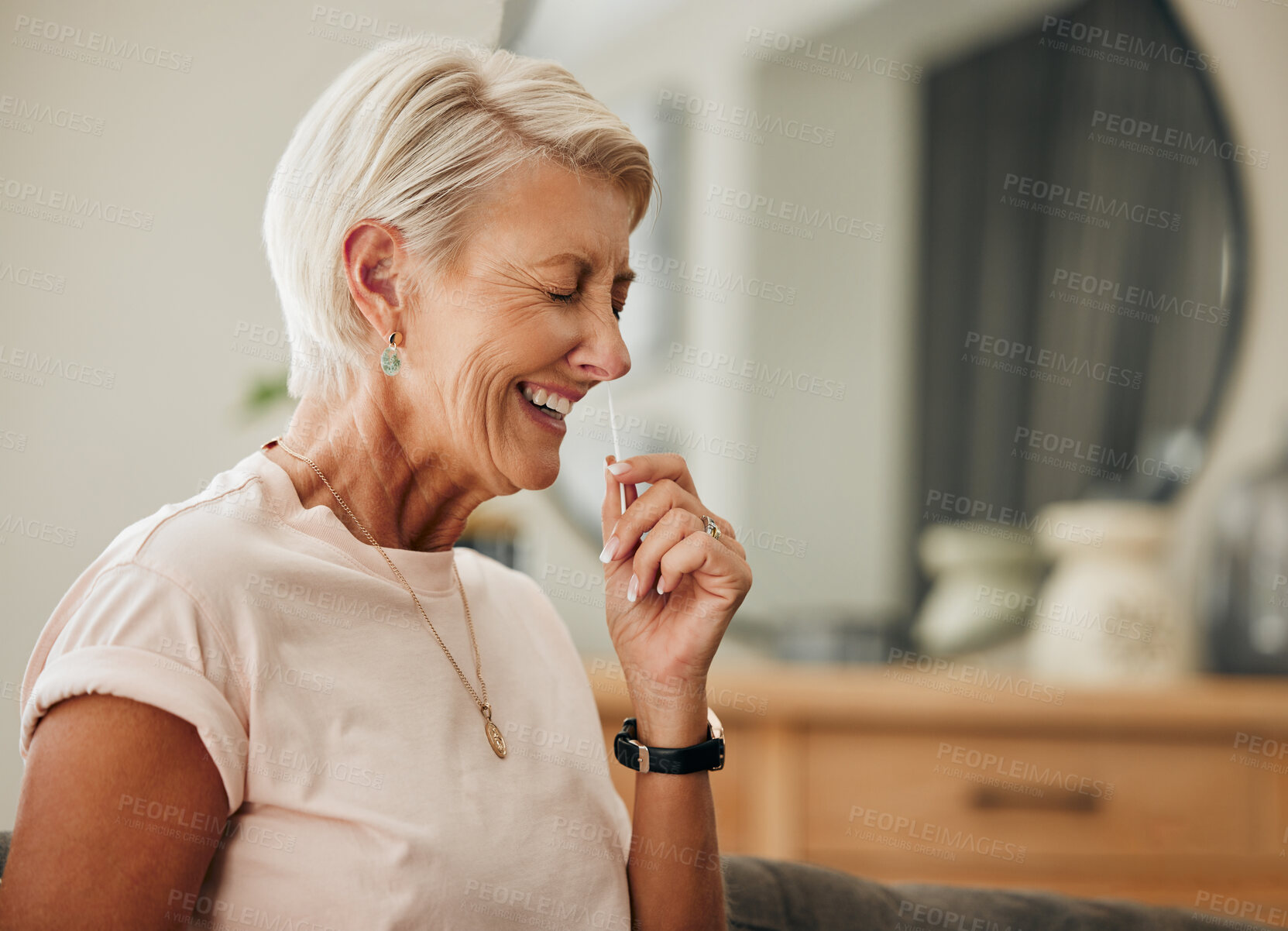 Buy stock photo Covid, antigen rapid test and woman with nose swab for health, illness, or virus PCR results of senior with at home. Elderly lady, coronavirus and laughing using nasal stick for possible infection