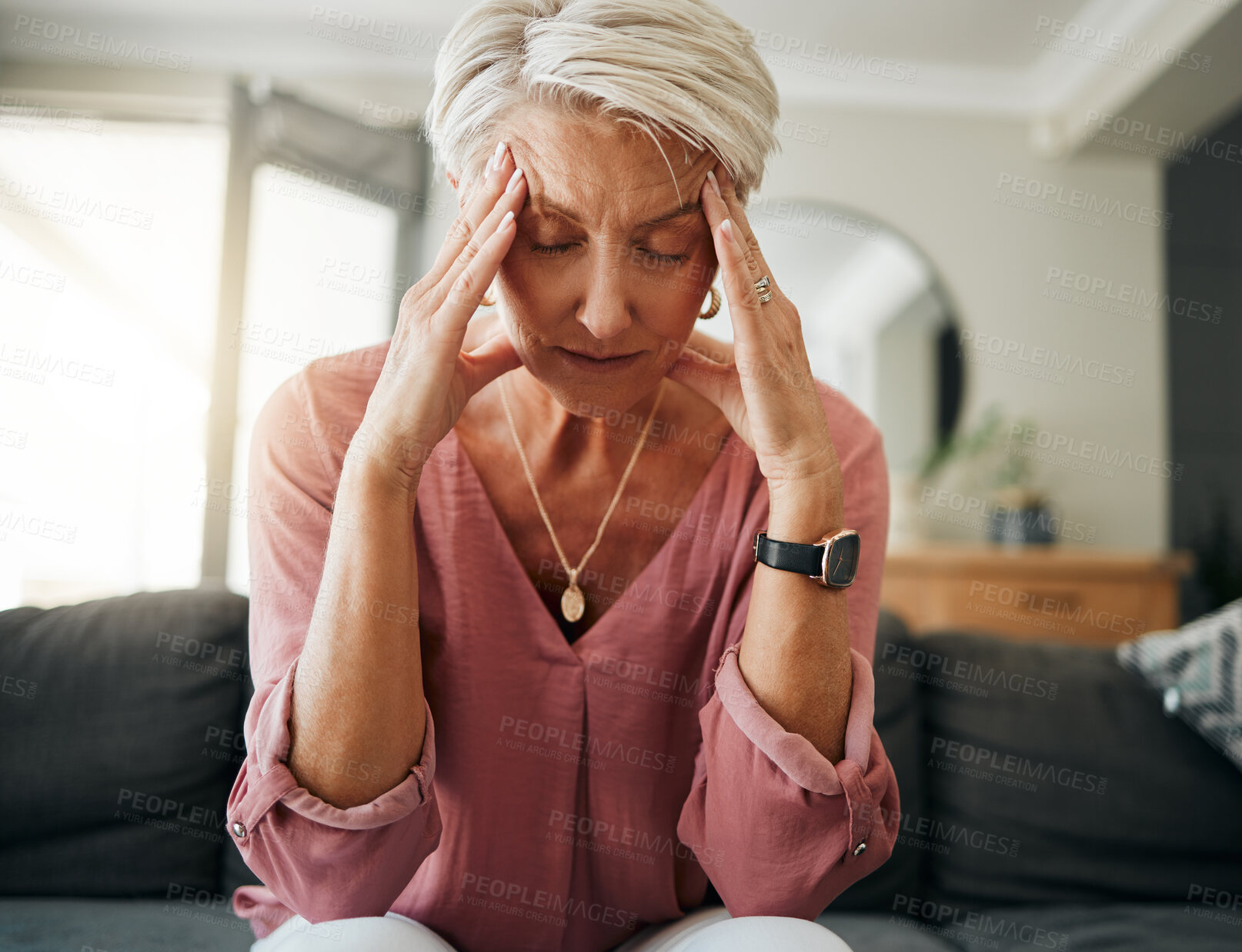 Buy stock photo Senior woman with headache pain, stress and depression while feeling tired, burnout and anxious on sofa in home. Anxiety and sad female with mental health or frustrated while thinking of life problem