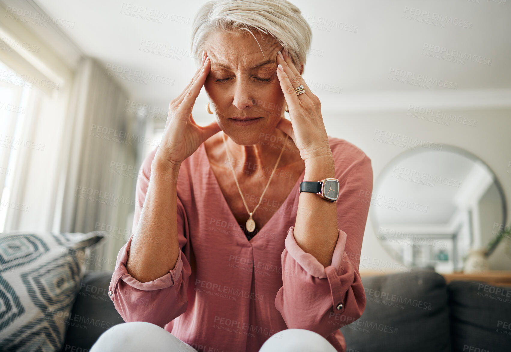 Buy stock photo Headache pain, anxiety and senior woman thinking of mental health problem on the living room sofa in house. Sad elderly person with depression, home stress and frustrated with retirement on the couch