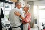 Cooking dance, dinner and senior couple dancing with smile while making lunch in the kitchen of house. Happy elderly man and woman doing jazz movement with love to music while preparing food in home