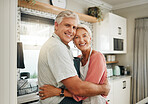 Love, hug and senior couple in the kitchen cooking dinner in a happy home enjoying retirement together at home. Romance, marriage and old woman hugging a romantic senior partner with a big smile