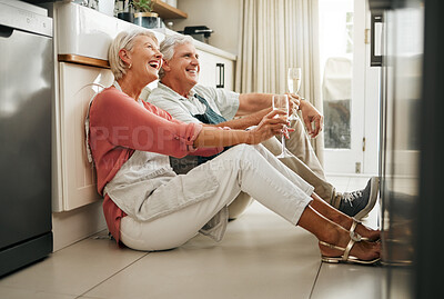 Buy stock photo Senior couple, wine and laughing on kitchen floor thinking happy memories and talking about love during a celebration of anniversary, new home or retirement. Old man and woman telling a funny joke 