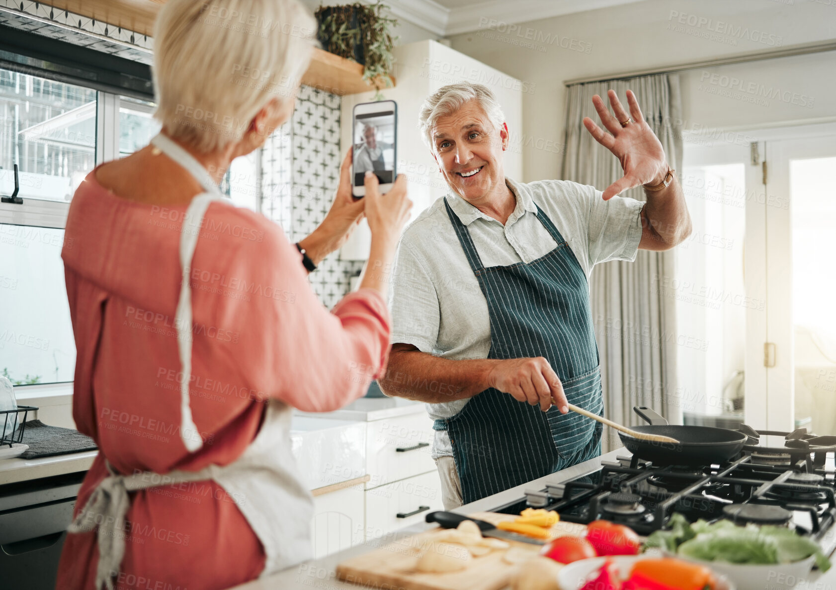 Buy stock photo Phone, cooking and photograph with a senior couple in the kitchen recording a video while preparing breakfast food. Mobile, love and fun with an elderly man and woman pensioner in the house together