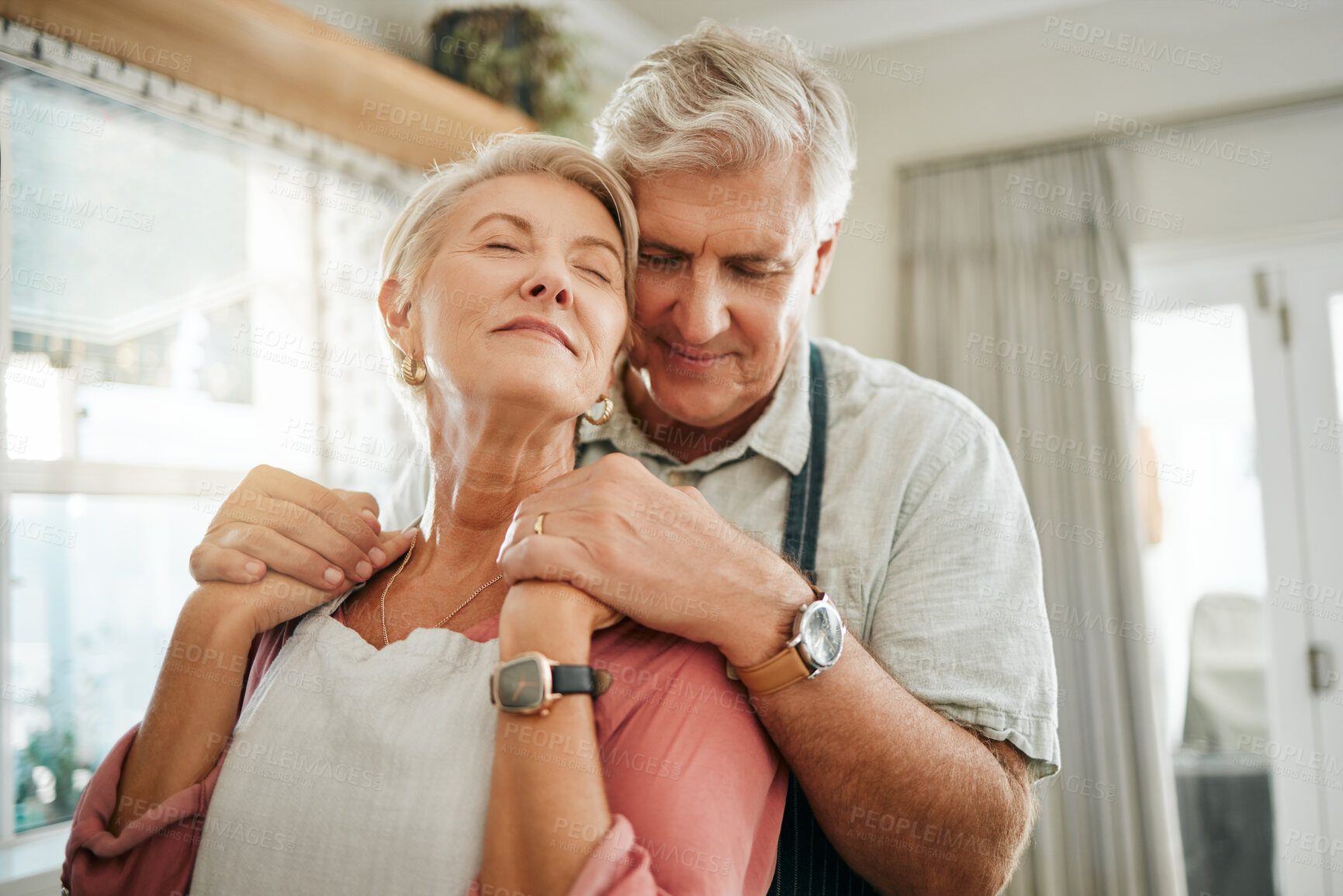 Buy stock photo Senior couple, love and care relax in calm embrace for relationship together at home. Elderly man and woman relaxing in loving romance hugging for peaceful bonding moment at the house indoors