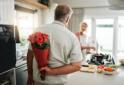 Buy stock photo Surprise, roses and a senior couple at home with romantic man spoiling wife with a bouquet of flowers on an anniversary, birthday or valentines day at home. Husband hiding gift for a woman behind his back